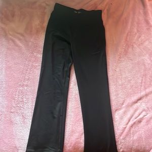 These are black athletic material leggings.